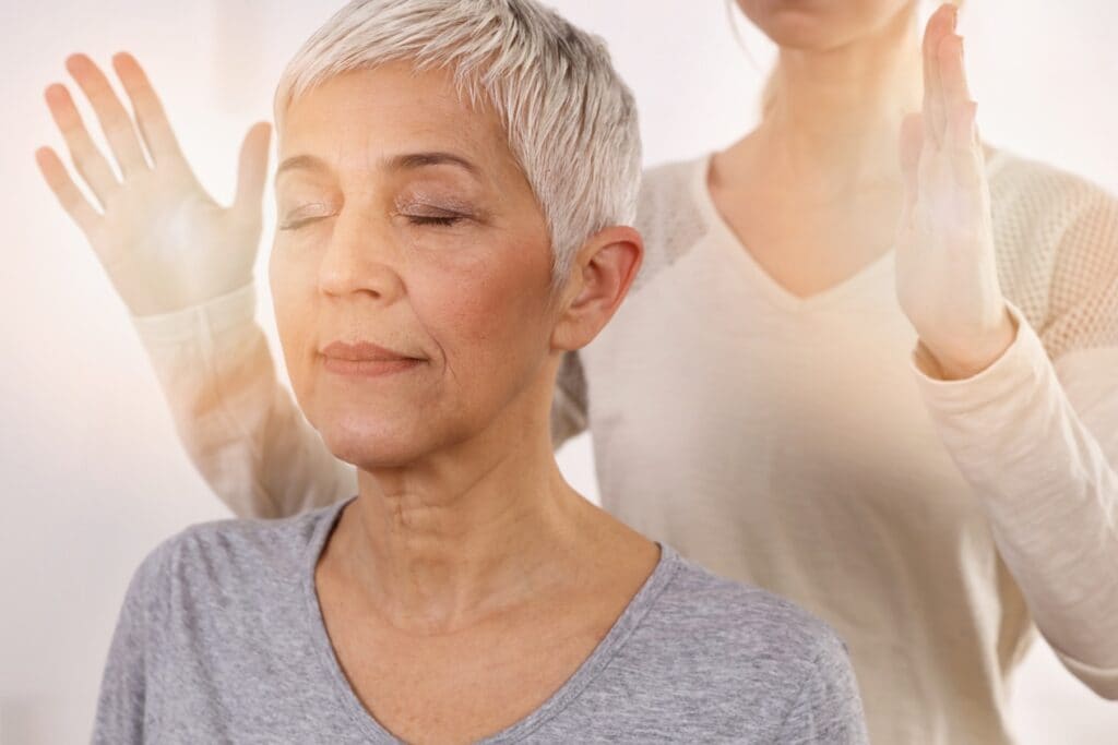 Woman having holistic healing treatment