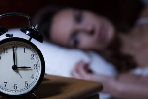 girl having trouble sleeping because of depression