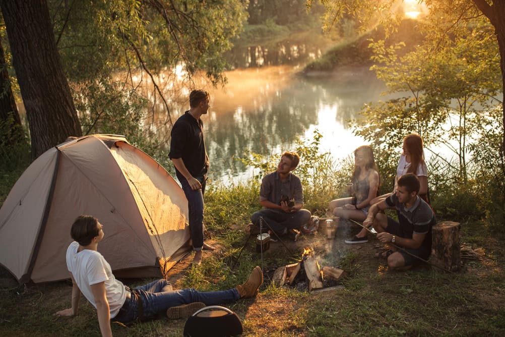 a group of people are spending great time in the picturesque place in the evening trying to escape the reality 