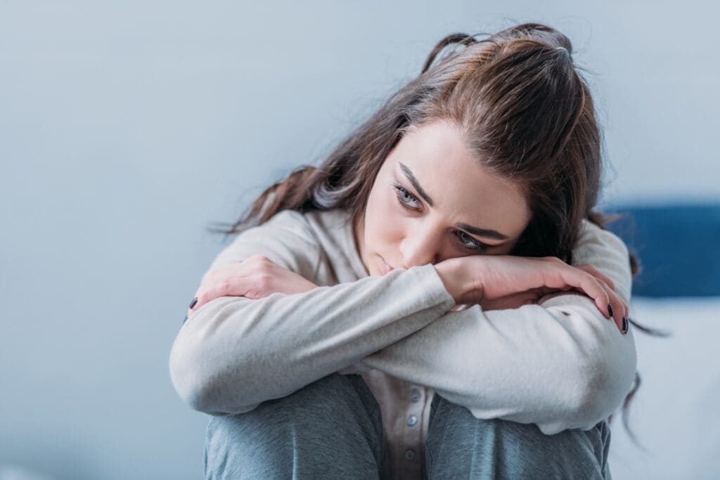 Sad woman reflecting on the rise of drug use in America