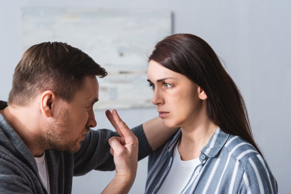 Man verbally and physically abusing wife