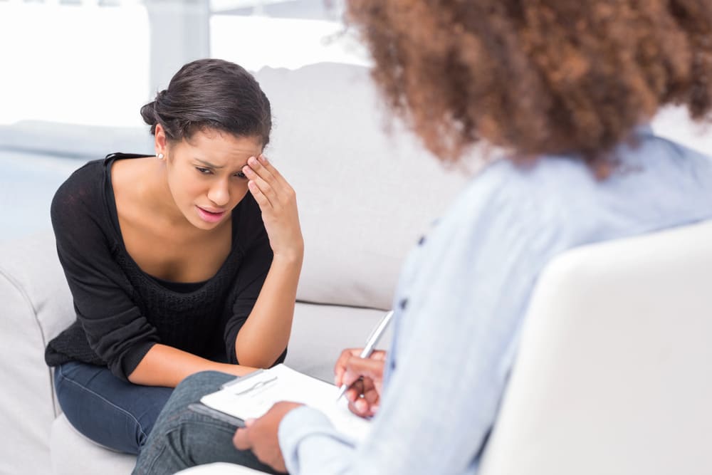 Woman struggling emotionally during addiction treatment