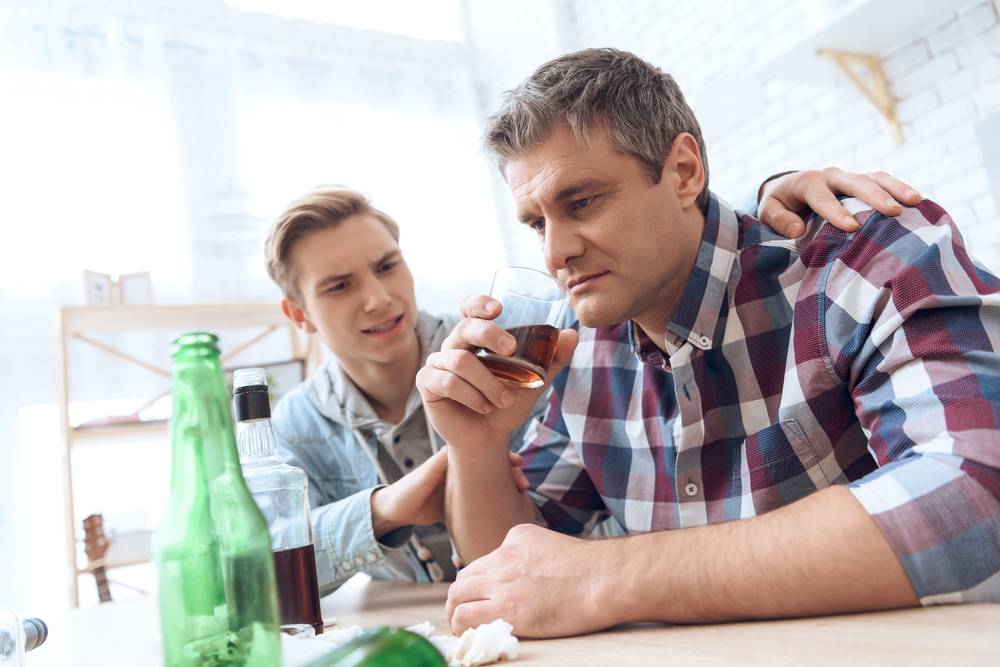 teenager stopping his alcoholic dad on drinking more