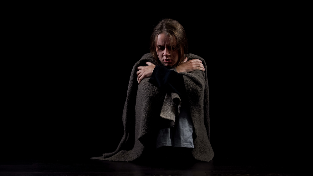 Woman experiencing opioid withdrawal and emotional distress