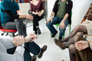 Shoulder-down shot of support group for 9/11 first responders and PTSD