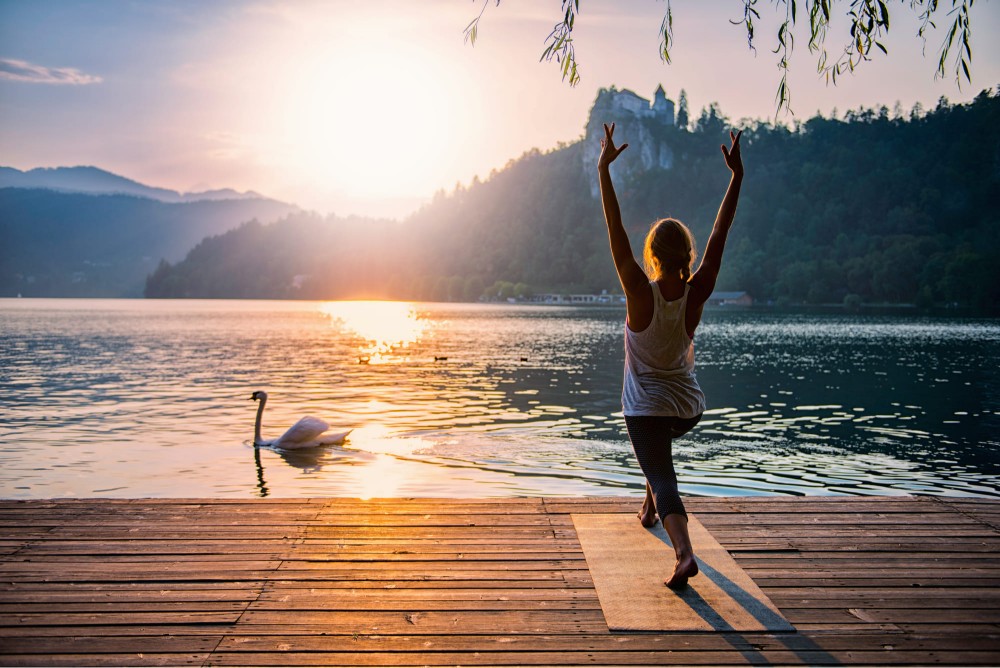 woman doing yoga early in the morning