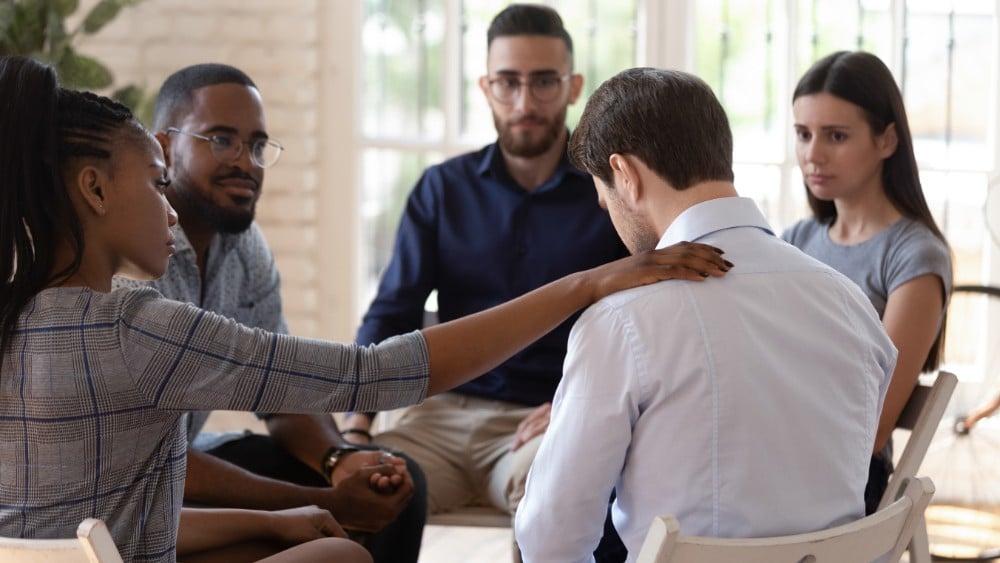 Man in Group therapy under residential treatment program