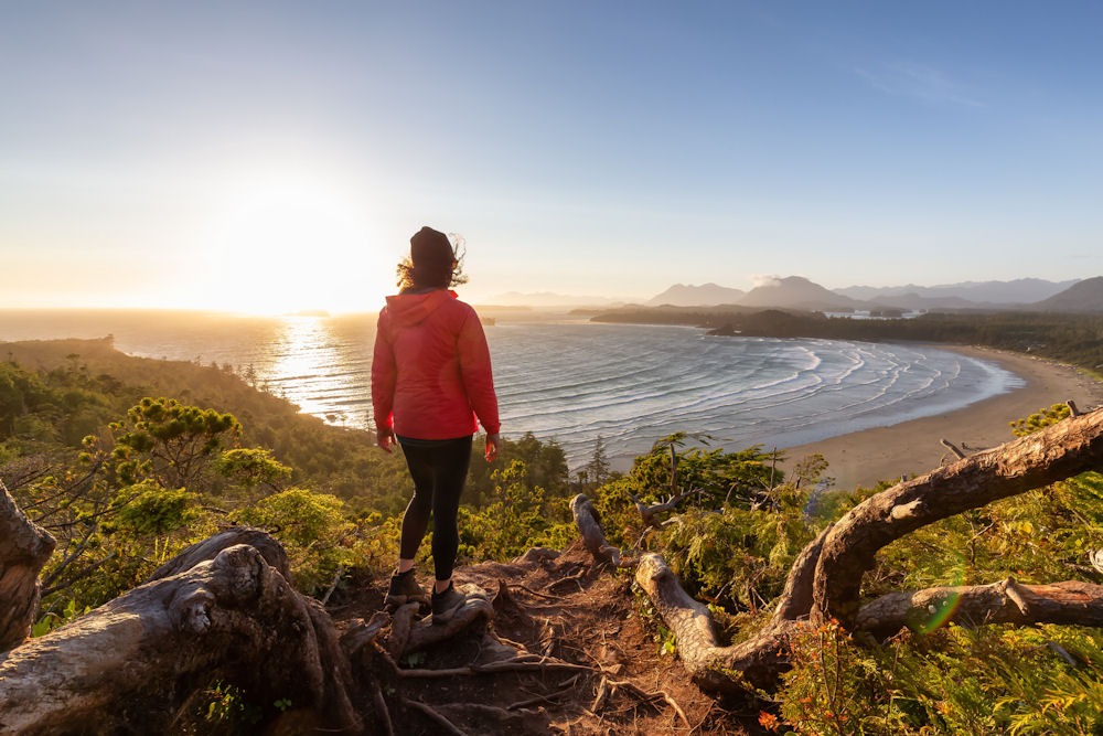 Person walking along cold shore while undergoing an end of year reflection