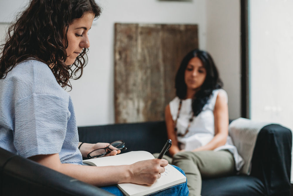 woman with a therapist in individual therapy for mental health