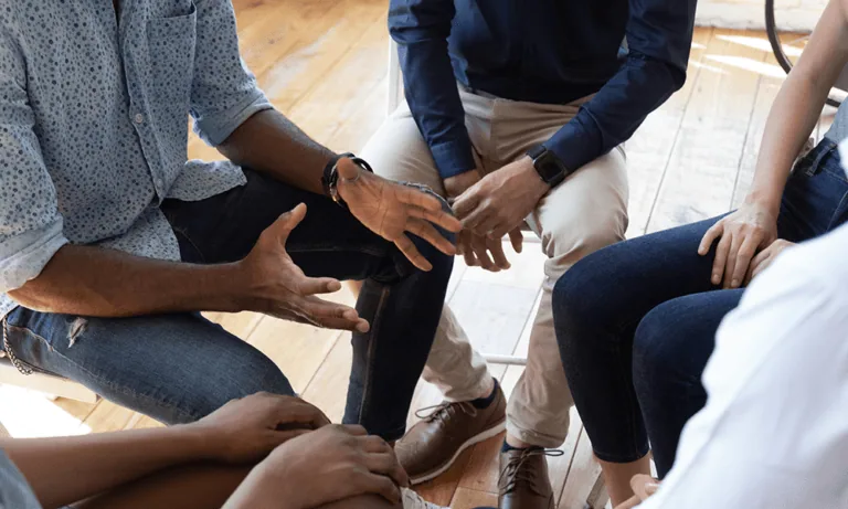 Group therapy session discussing the pink cloud phase