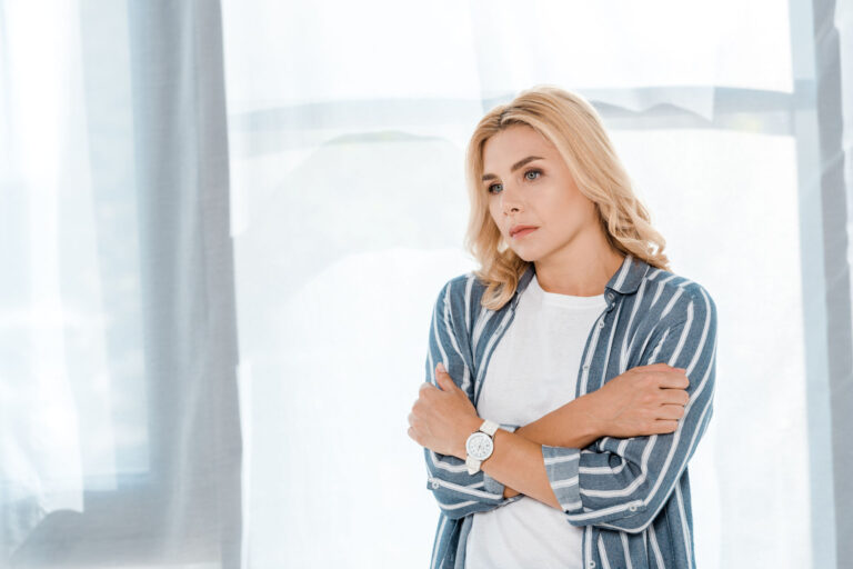 Sad woman showing signs of depression relapse