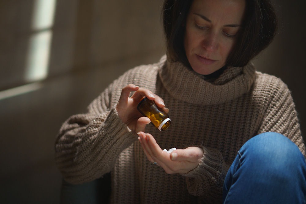 Woman taking depression medication