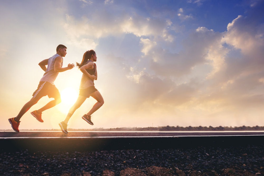 breaking-addiction-timeline Man and woman running on track against distant sunset