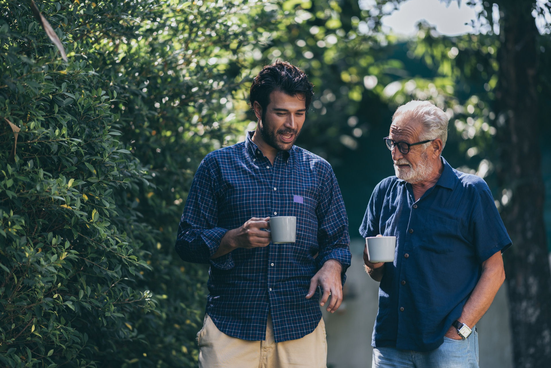 how-long-to-overcome-addiction Two men with coffee cups discuss how long it takes to break an addiction