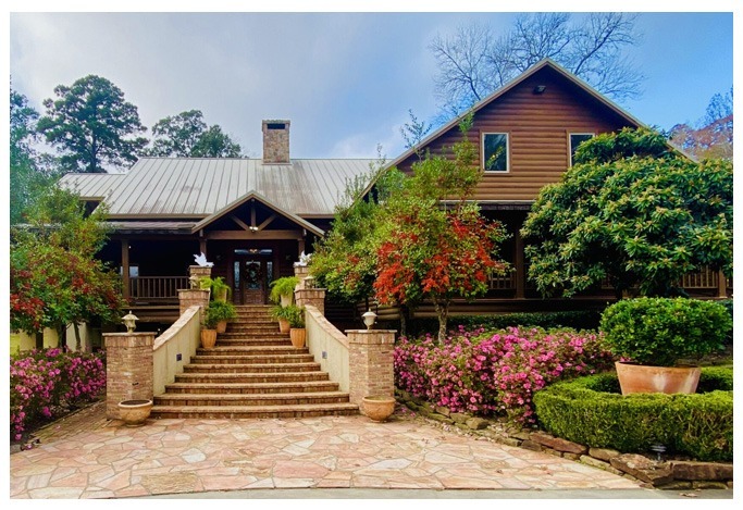 Peaceful porch view overlooking a lake and forest at a Texas drug rehab retreat