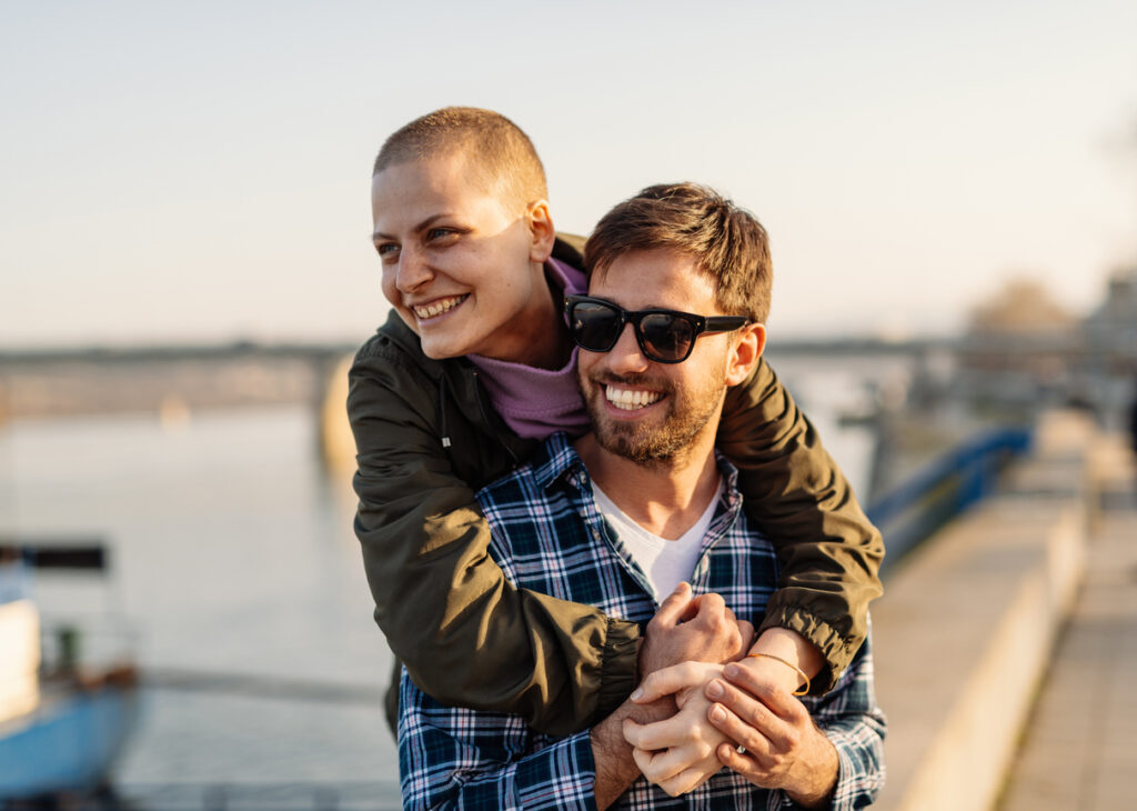 Couple embracing outdoors representing healthy relationships and emotional connection during recovery