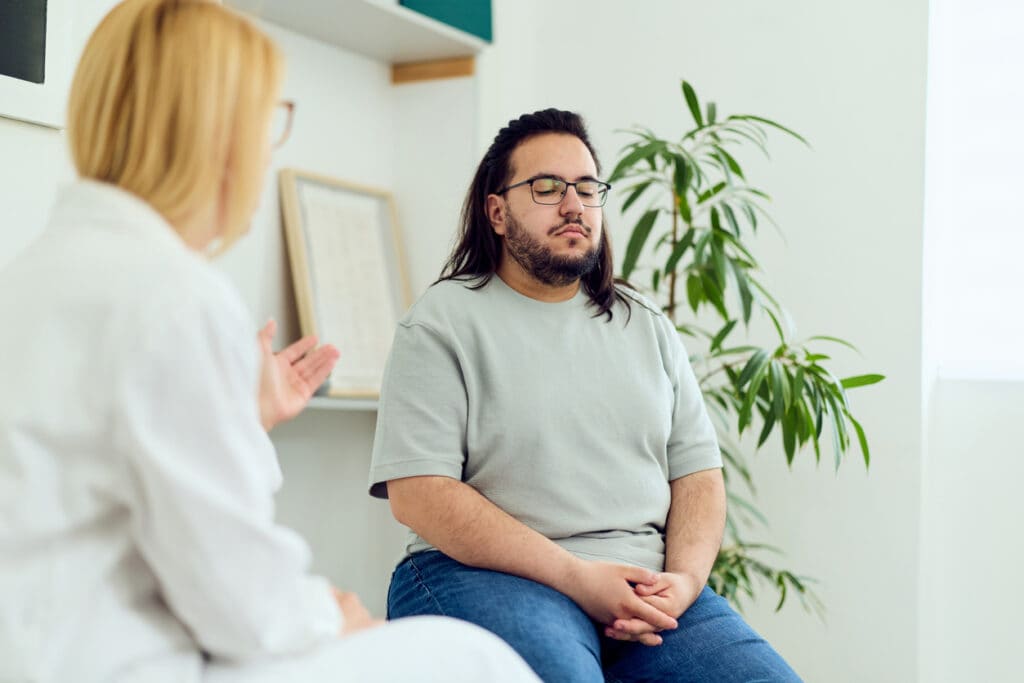 Healthcare provider speaking with a client about medical detox near Beaumont and East Texas.